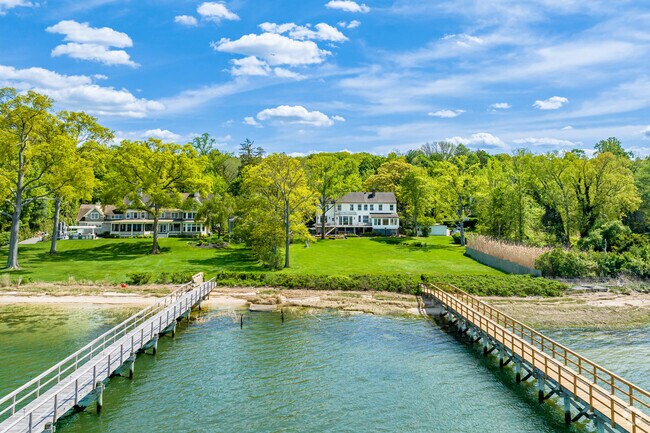Waterfront homes in Oyster Bay Cove often feature private docks for boating and fishing.