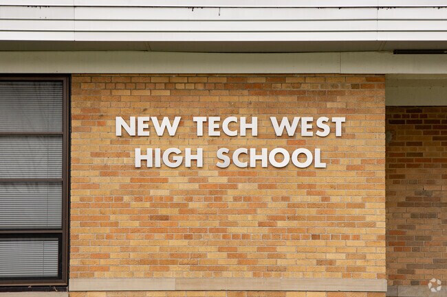 New Tech West school's name graces the building, a beacon for learning and dreams.