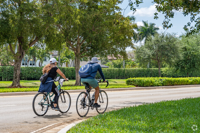 Many Huntington residents enjoy riding their bikes around the tree lined streets of the community.
