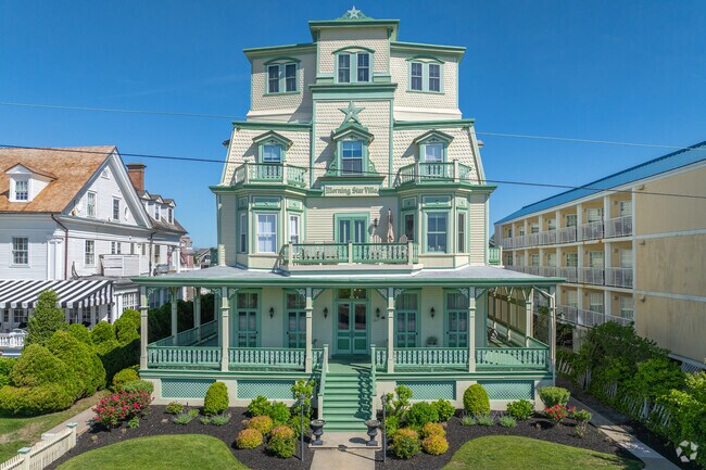 Elegant hotels sit on the beach, perfect for a summer rental for families and friends in Cape May.