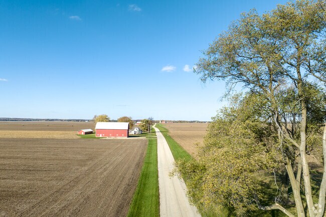Farm homes located near a main road and surrounded by farm fields are common in Hartland.