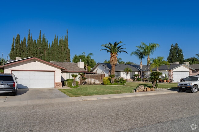 Cyprus and palm trees are a staple in the well manicured landscaping of Highland Knolls homes.