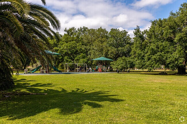 Fleur De Lis Park offers playgrounds and open green space in West End near the lake.