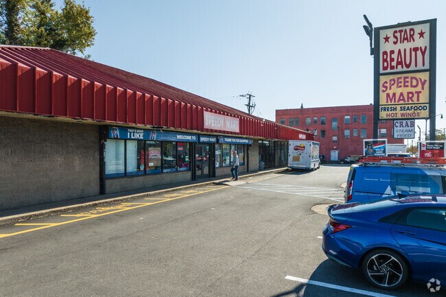 A local plaza features a beauty store and market in Marshall.