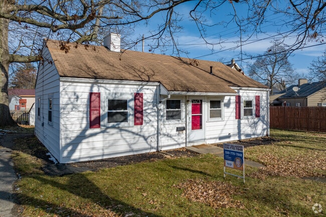 Ranch style home with a tidy lawn in McDonald.