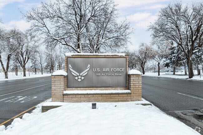 Snow laden trees surround a classic sign at Hill Air Force Base in Southeast Ogden.