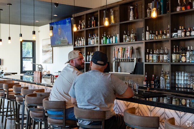 Residents enjoy winding down at the end of the day at Beso Cocina, a favorite local spot.