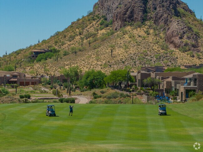 Golfers enjoy pristine green fairways and great views in Gold Canyon.