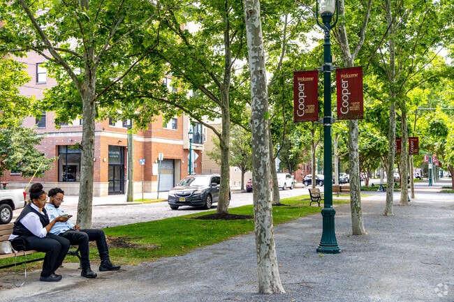 Find shade under the trees on your lunch break in Lanning Sq Camden.