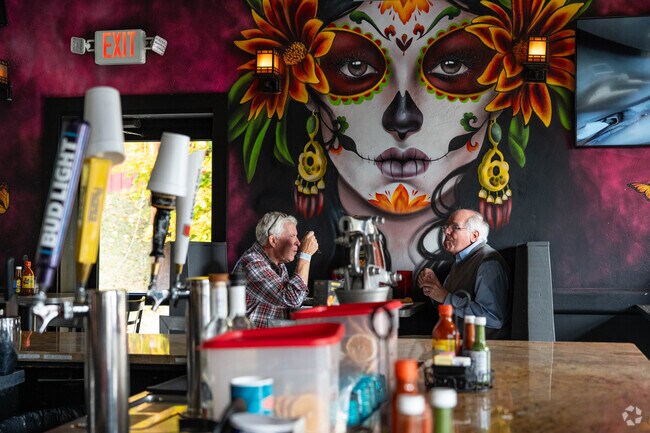 Gentleman enjoying dinner at El Meson in the Mud Brook neighborhood.