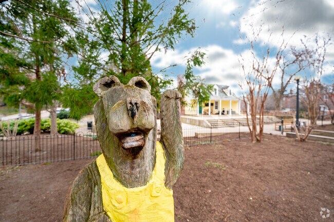 Mitchell Park in Sheridan-Kalorama features a wooden statue of a bear.