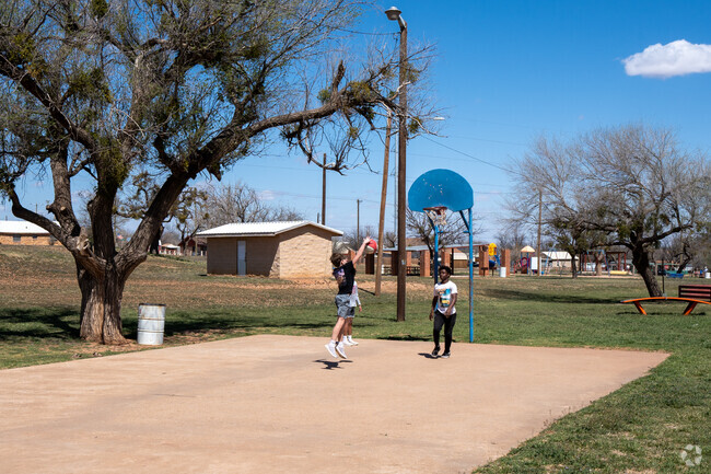 Families in Sweetwater enjoy playing basketball at their local park.
