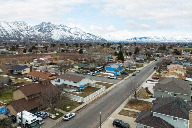 A stunning aerial shot of Cascade, a serene community nestled at the base of the mountains.