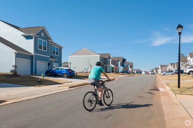 On the streets of the new subdivisions many people doing sports in Reedy Fork Ranch.