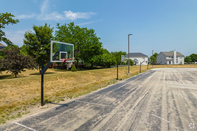 Students and play basketball at the several hoops behind Liberty Elementary.