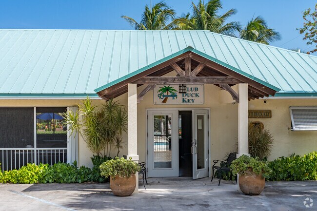 The Duck Key Club offers a pool, clubhouse, tennis court and green space.