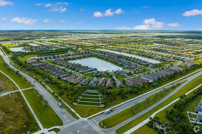 Aerial context of the neighborhood and homes at Riverland in Valencia Cay subdivision.