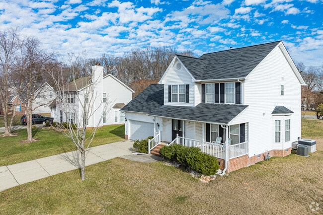 Two-story modern homes in Florence feature well-manicured lawns.