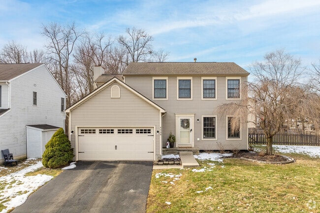 A colonial style home in Wynstone features an attached two-car garage.