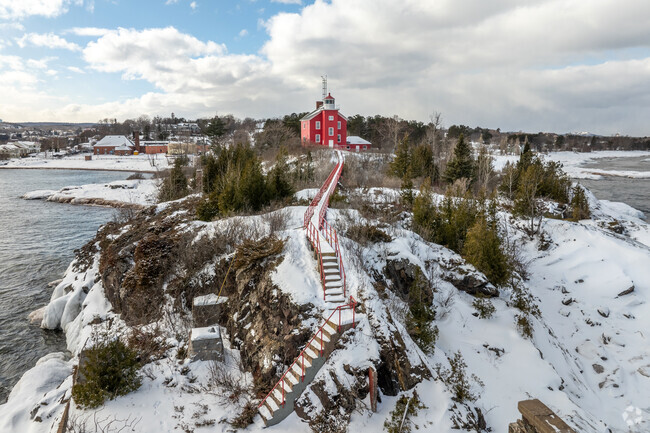 Marvel at Marquette’s iconic lighthouse, guiding ships along Lake Superior’s stunning shores.