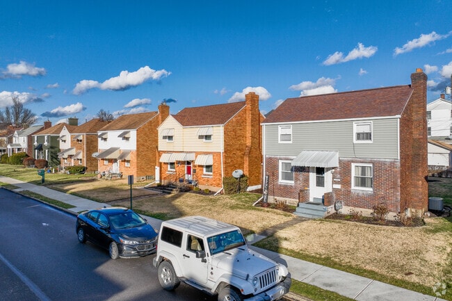 Small front yards offering a bit of greenery and space for residents to personalize in Ambridge.