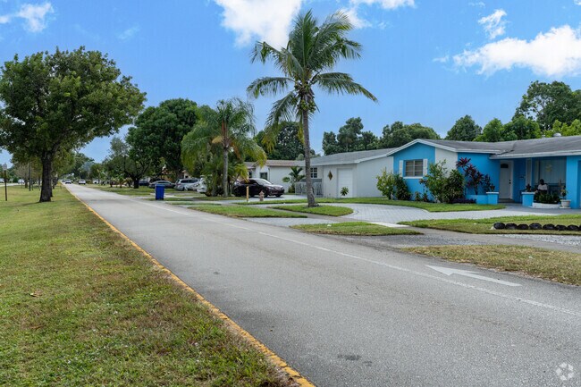 A typical street view in Miramar Tropical showcasing its homes.