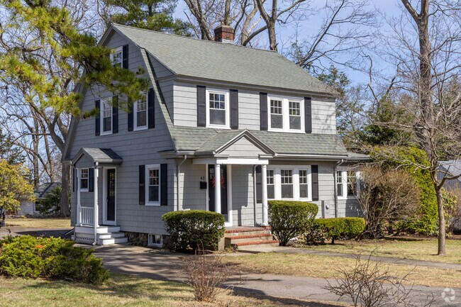 A Dutch Colonial styled home with it's unique roofline in the West Side neighborhood of Wakefield, MA.