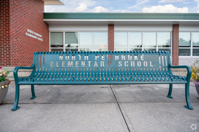 Wait for your ride on the bench outside of North Pembroke Elementary School in Pembroke.