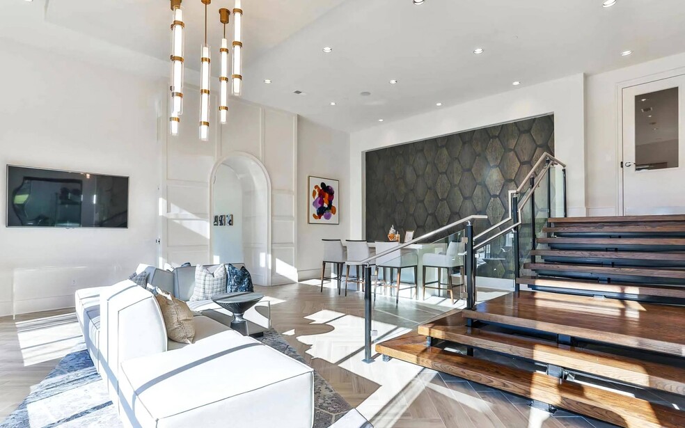 Indoor Lounge Area with Upholstered Sofas and Raised Bar Seating Section