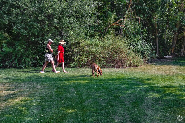 Women walk at River Hollow Park near Adams.