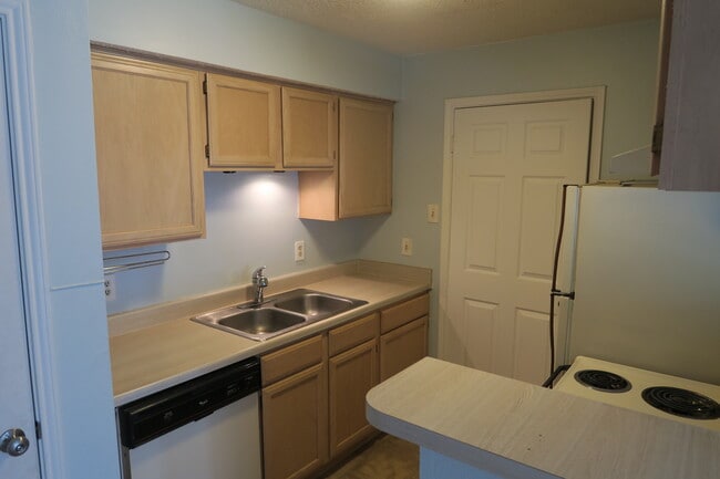 kitchen with door to laundry room