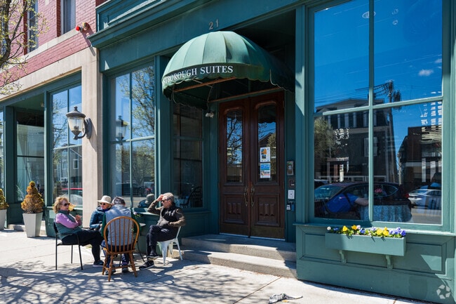 In good weather, locals sit outside Westborough Suites for coffee.