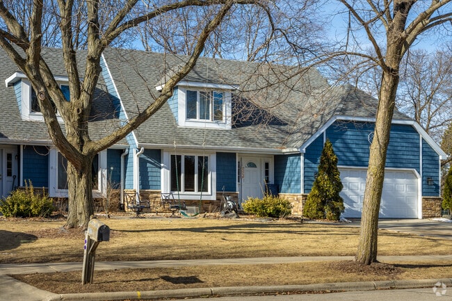 New Traditional homes like this blue residence are common in Sauk Creek.