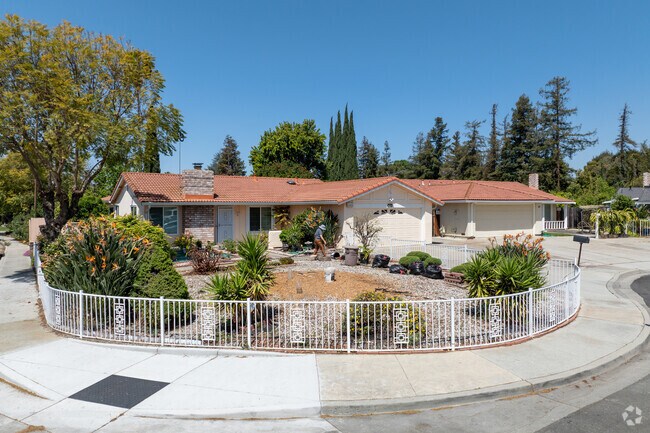 Ranch-style home in Brooktree blends red tile roofing, brick accents and drought-tolerant landscaping.