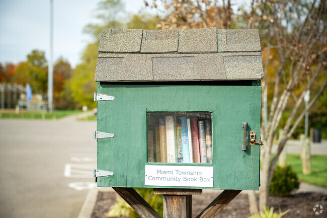 Residents of Outer Loveland enjoy sharing books through the tiny library boxes.