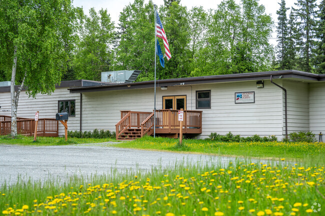 Anchorage Junior Academy front entrance and flag pole.
