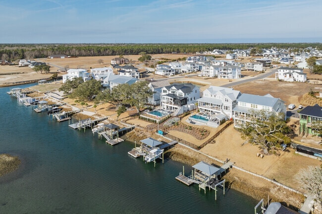 Discover waterfront living with coastal home styles and private docks in Hampstead.