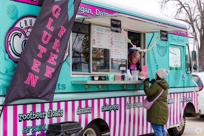 Guests stop by food trucks to grab a sweet treat during the Holiday Market event.