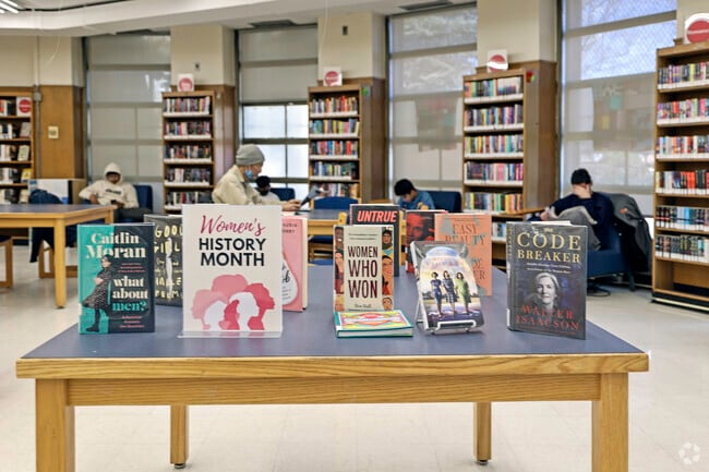 Residents of the Westchester Square community enjoying a day at the public library.