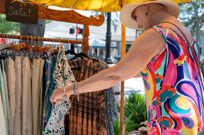 Shop owners and vendors sell gifts and holiday themed items at the Christmas in July Market.