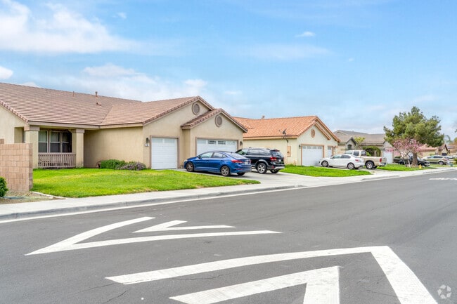 A sleek row of contemporary single-family homes in Ramona, offering modern design and comfortable living in a scenic, vibrant community.