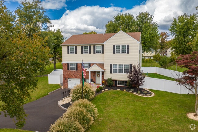 Wide driveways and fenced-in yards add curb appeal to single-family homes in Warrington.