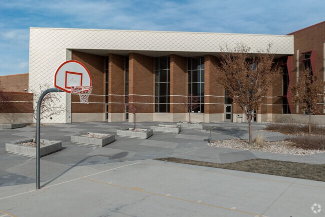A basketball court is located behind Midvale Middle School.