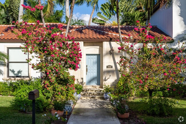 Gorgeous lush foliage overgrows this Bayshore home.