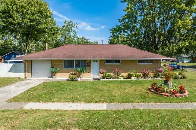 Midcentury home in Linwood features beautiful landscaping.