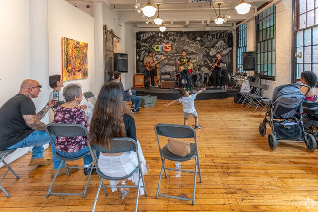 Visitors enjoy live music at the YOHO Artists Open Studio during Yonkers Arts Weekend.