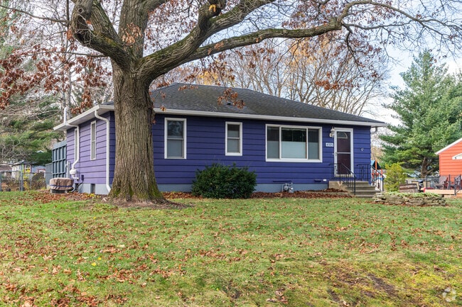 Colorful ramblers add charm to the residential streets in Lake Edge.