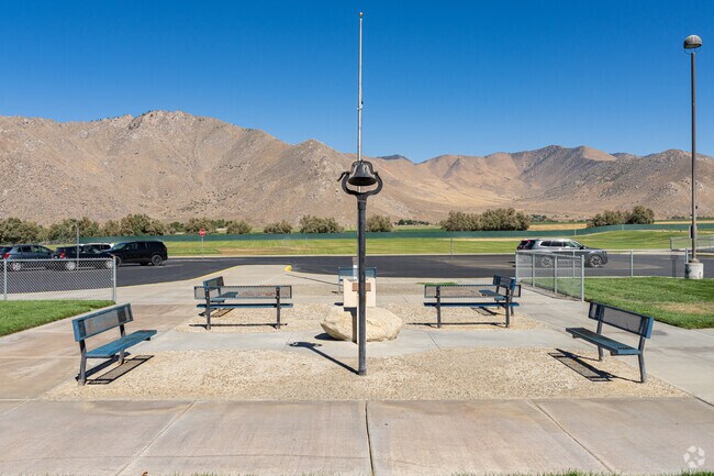 South Fork Middle School features a quiet place with benches and an old school bell.