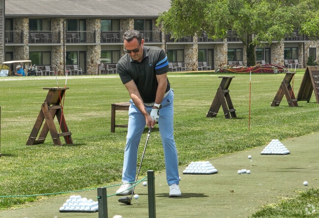 A Dr. Phillips residents practices his swing at the Bay Hill PGA Tour golf course.