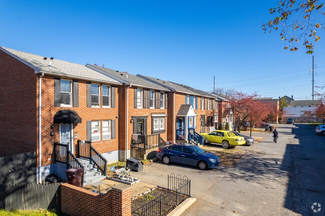 Brick rowhomes are common, with some offering garages or off-street parking.